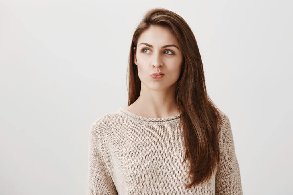 intrigued thoughtful cute girl thinking looking left pondering decision 1024x683 1