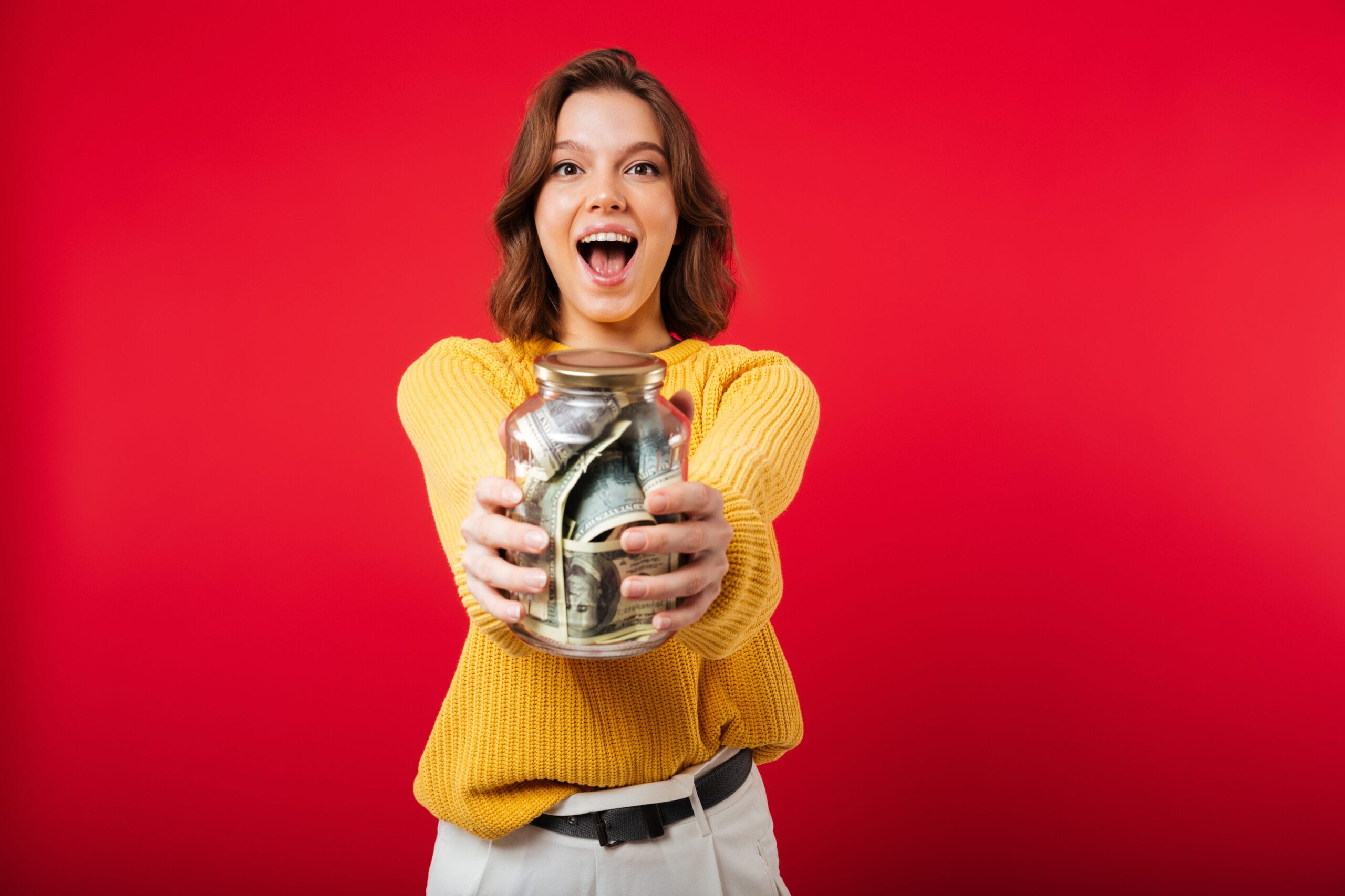 portrait excited woman showing jar scaled 1