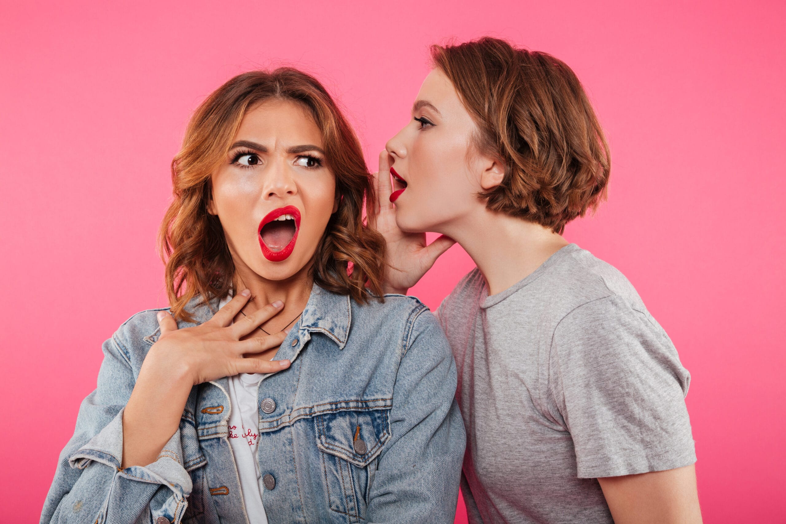 shocked two women friends gossiping scaled 1